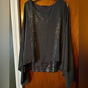 Cold shoulder sequin evening blouse.